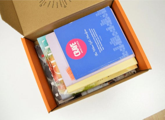Naked snacks snack box repurposed into book storage