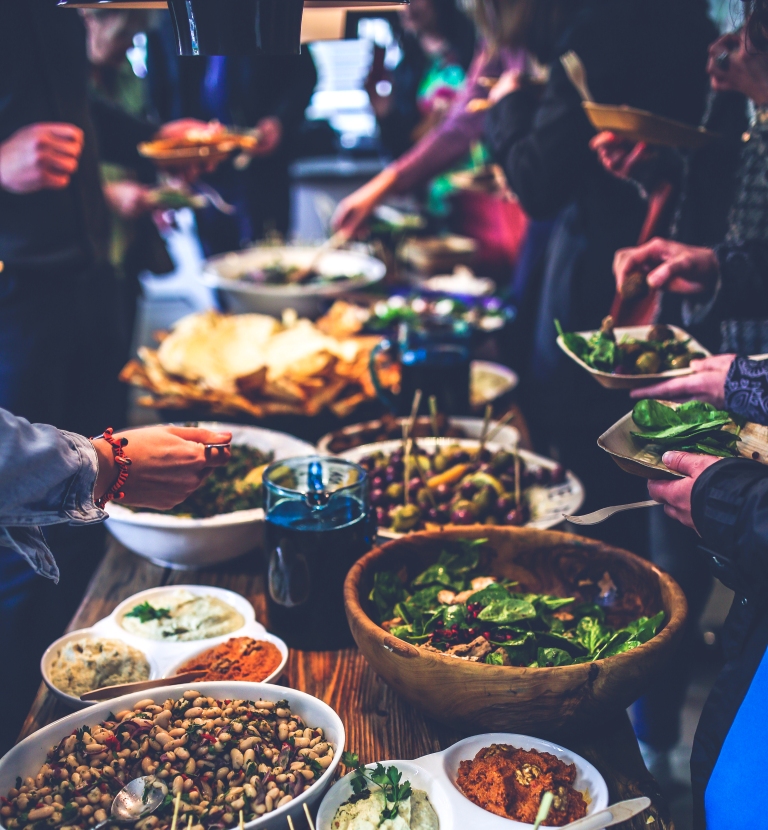 sharing meals at a christmas dinner potluck