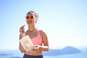 Cam Lee snacking on a bag of Naked Snacks