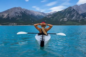 Girl kayaking on a lake