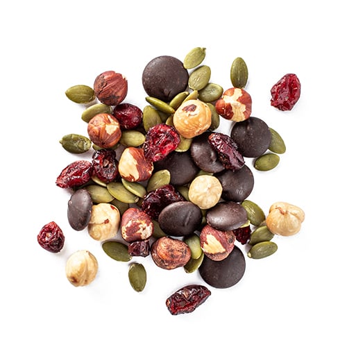 oh hazel snack mix made of dried cranberries, 70% dark chocolate buttons, hazelnuts and pumpkin seeds